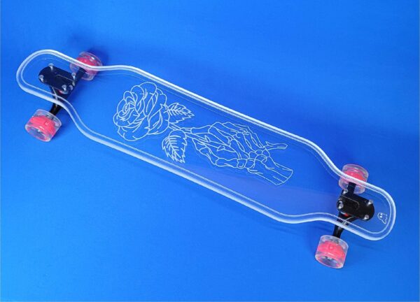 Skeleton hand holding a rose engraved on a clear longboard by Ghost Boards