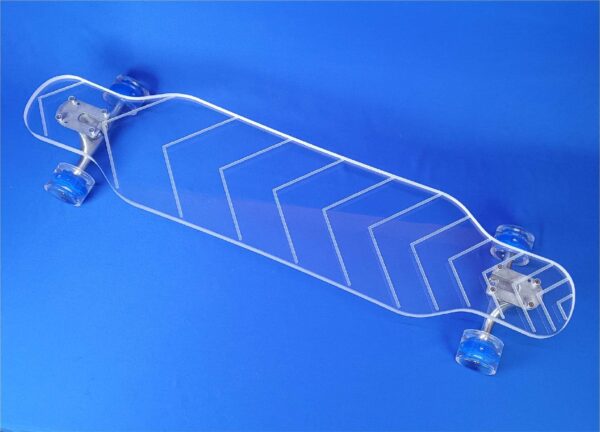clear longboard with half diamond lines engraved along the board.